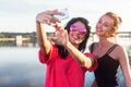 Women taking picture of herself, selfie at beach Lifestyle sunny image best friend girls happy vacations.