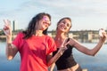 Women taking picture of herself, selfie at beach Lifestyle sunny image best friend girls happy vacations.