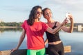 Women taking picture of herself, selfie at beach Lifestyle sunny image best friend girls happy vacations.