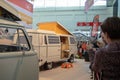 Women taking picutres with her phone from the world record full-size VW campervan made out of Lego, at the free fair in munich