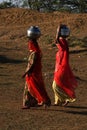 Women taking water at Sand Dunes Khuri, Sam, Jaiselmer, India Royalty Free Stock Photo