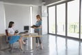 Women Talking At Desk In Empty Office Royalty Free Stock Photo