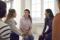 Women talking and helping each other in therapy session or support group meeting Royalty Free Stock Photo