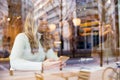 Women Talking and Looking Out Window At Cafe in City Royalty Free Stock Photo