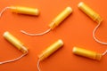 Women tampons on orange background, top view Royalty Free Stock Photo