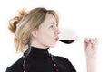 A women tasting a glass of red wine