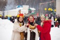 Women tasting pancake during Shrovetide