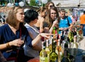 Women tasting white wine in outdoor bar