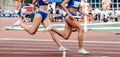 women team running relay race in track stadium summer athletics Royalty Free Stock Photo