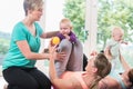 Women and their babies in mother-child gymnastic course