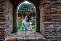 Women tourist at ancient temple in Thailand with her face mask