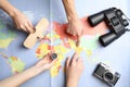 Women with tourist items planning vacation on world map. Travel agency