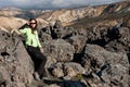 Women tourist posing on the lava field