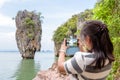 Women tourist shooting natural view by mobile phone Royalty Free Stock Photo