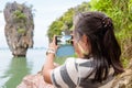 Women tourist shooting natural view by mobile phone Royalty Free Stock Photo