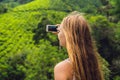 Women tourist at a tea plantation. Natural selected, Fresh tea leaves in tea farm in Cameron Highlands, Malaysia Royalty Free Stock Photo