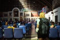 women tourists and backpack waiting her friend at Bangkok Railway Station Thailand