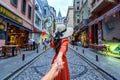 Women tourists holding man`s hand and leading him to Galata tower in Istanbul, Turkey. Royalty Free Stock Photo