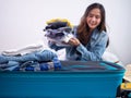 Women or tourists are packing clothes into bags for the long holidays or vacation. prepare to travel