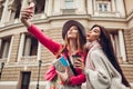 Women tourists taking selfie going sightseeing in Odessa. Happy friends travelers having fun Royalty Free Stock Photo