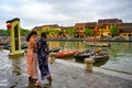 Asian women taking photos on canal in tourist destination Hoi An, Vietnamese women in Hoi An, Vietnam Royalty Free Stock Photo