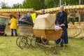 Women in traditional dresses to show the antique prams on the sheepshearingfestival in Exloo, the Netherlands