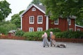 Women with traditional swedish house