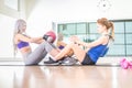 Women training abs in a gym Royalty Free Stock Photo