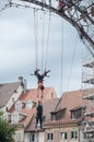 Women training on trapeze for an outdoor aerobatics show in the main place of Mulhouse