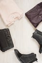 Women trendy fashion clothes collage with sweater, leather pants, military boots and bag. Flat lay