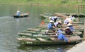 Women in triangular hat in a paddle boats in Vietnam