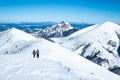 Women on trip in winter mountains
