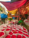 women Trying To Sell Red Rose flowers buffets in Dadar flower market, Mumbai, India