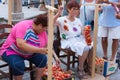 Women tying tomatoes together to form the hanging bunches during Tomato `Ramellet` Night Fair Royalty Free Stock Photo