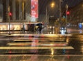 Women with umbrella under rain night city blurred light bokeh defocus rainy stree evening light bluured reflection on asphalt cou