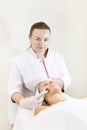 The woman undergoes the procedure of medical micro needle therapy Royalty Free Stock Photo