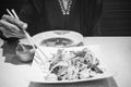 Women use chopsticks with tofu salads Royalty Free Stock Photo