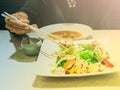 Women use chopsticks with tofu salads Royalty Free Stock Photo