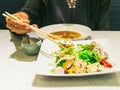 Women use chopsticks with tofu salads Royalty Free Stock Photo