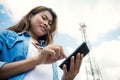 Women use smartphone and satellite telecommunication tow