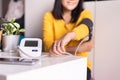 Woman using blood pressure & heart rate monitors in yourself at home Royalty Free Stock Photo