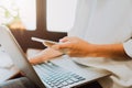 Women using a laptop in the display and technology advances in stores. Take your screen to put on advertising. Royalty Free Stock Photo