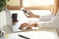 Women using laptop and smartphone on office desk Royalty Free Stock Photo