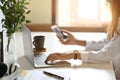 Women using laptop and smartphone on office desk Royalty Free Stock Photo