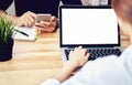 Women using a laptop on white screen. Take your screen to put on advertising. Royalty Free Stock Photo