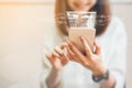 Women using a smartphone in the display and technology advances in stores. Royalty Free Stock Photo