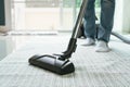 Women using vacuum cleaner cleaning carpet in the living room Royalty Free Stock Photo