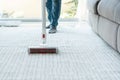 Women using wireless vacuum cleaner cleaning carpet in living room at home Royalty Free Stock Photo