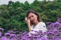 Women in the Verbena field are blooming