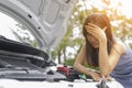 Women are very stressed because of her car breakdown.